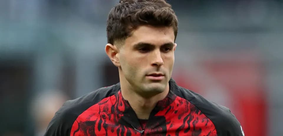 Player walking on the pitch in team uniform