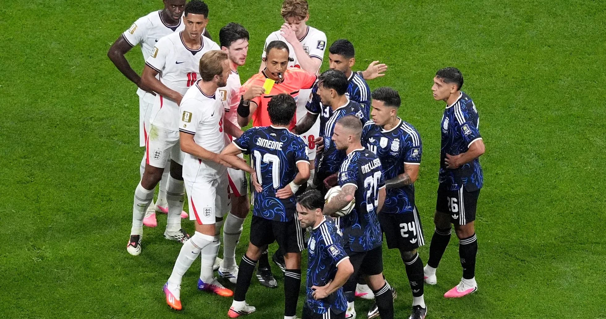 England and Argentina players arguing with referee