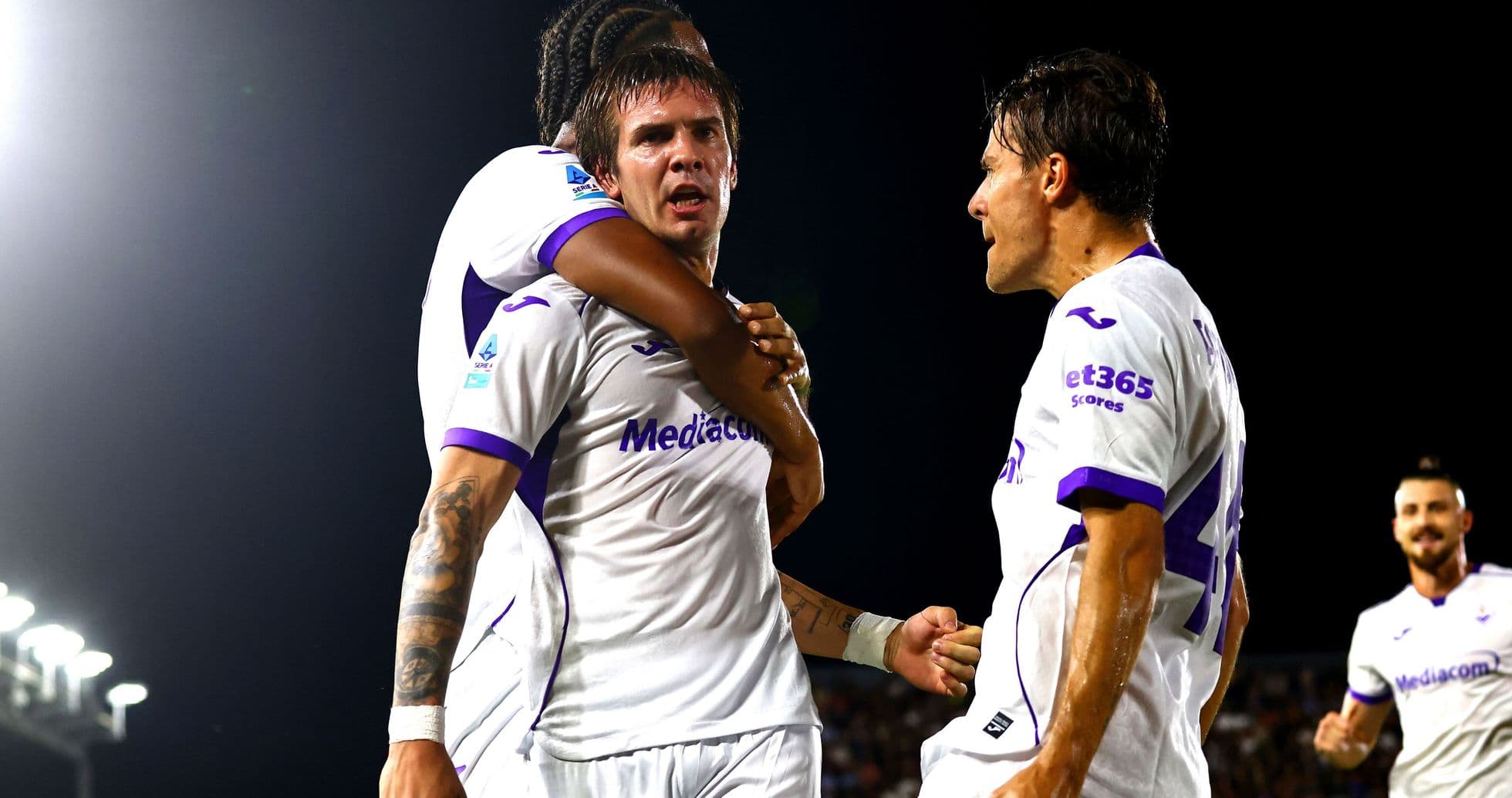 Players celebrating a goal during a match