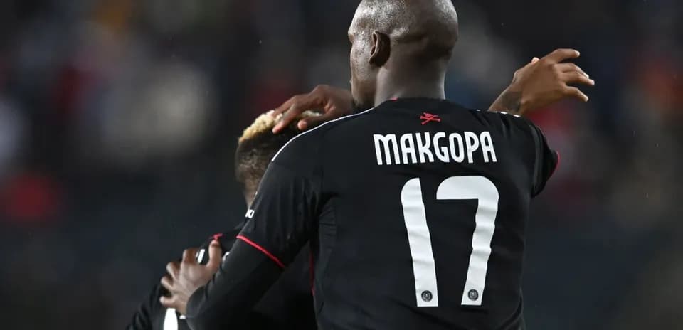 Players celebrating a goal during a match