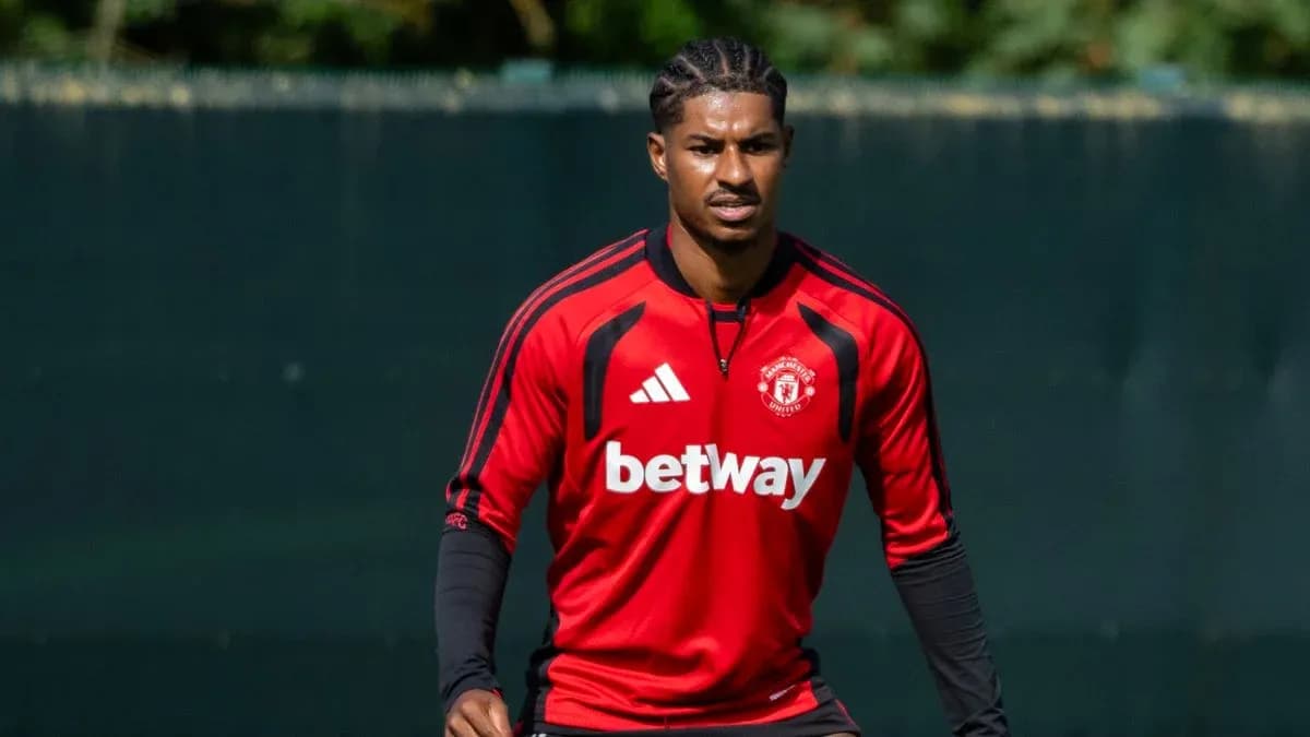 Player training in Manchester United kit on pitch