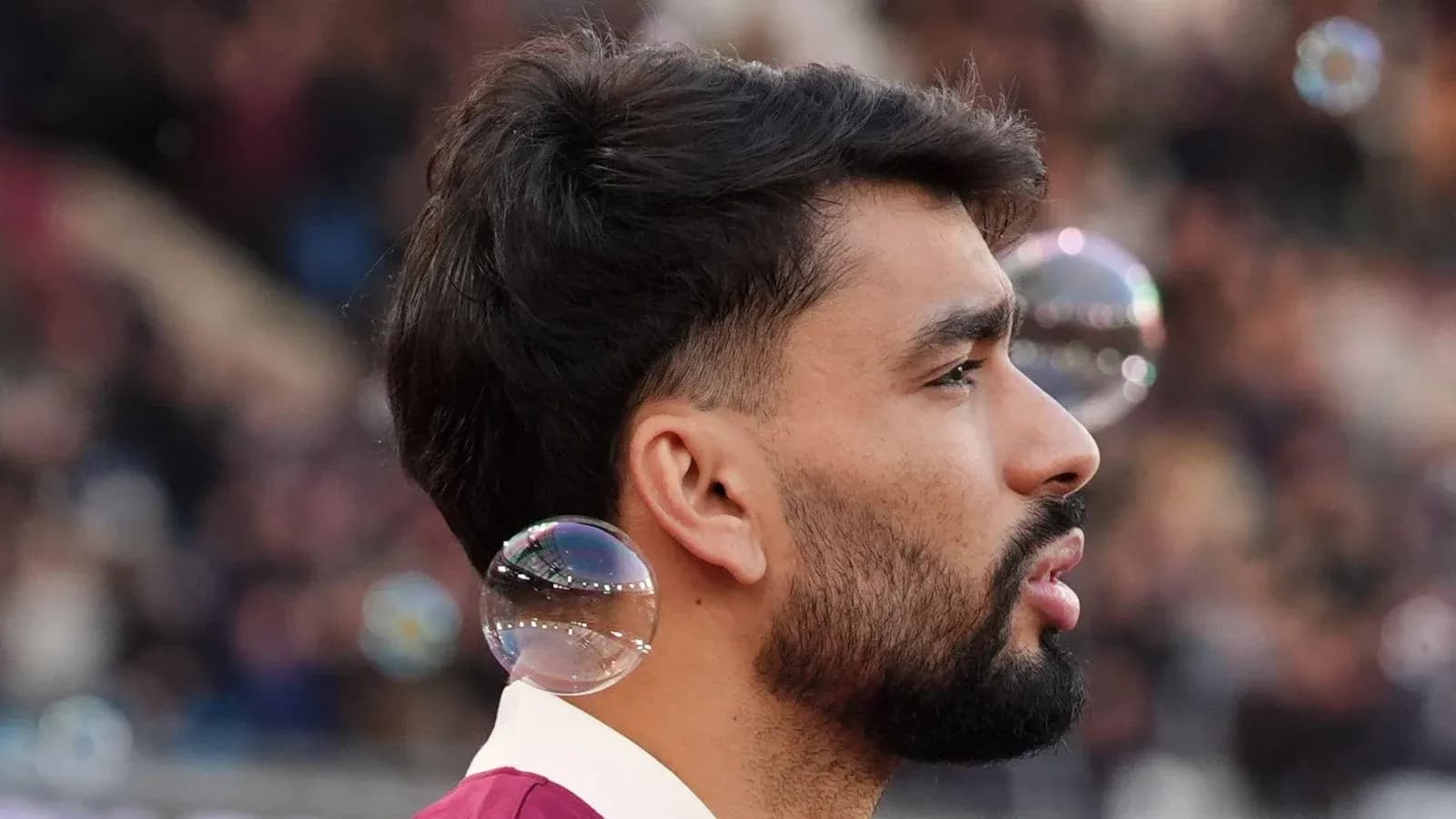 Player with bubbles during pre-match warm-up