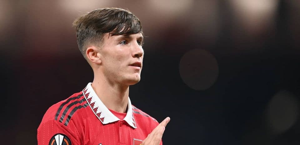 Player in red jersey gesturing during match
