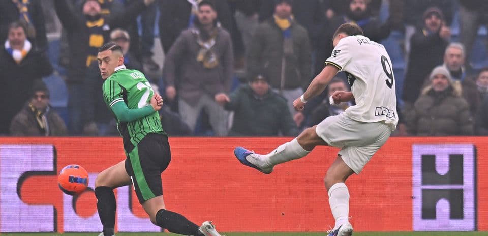 Player striking the ball during Parma vs Sassuolo match