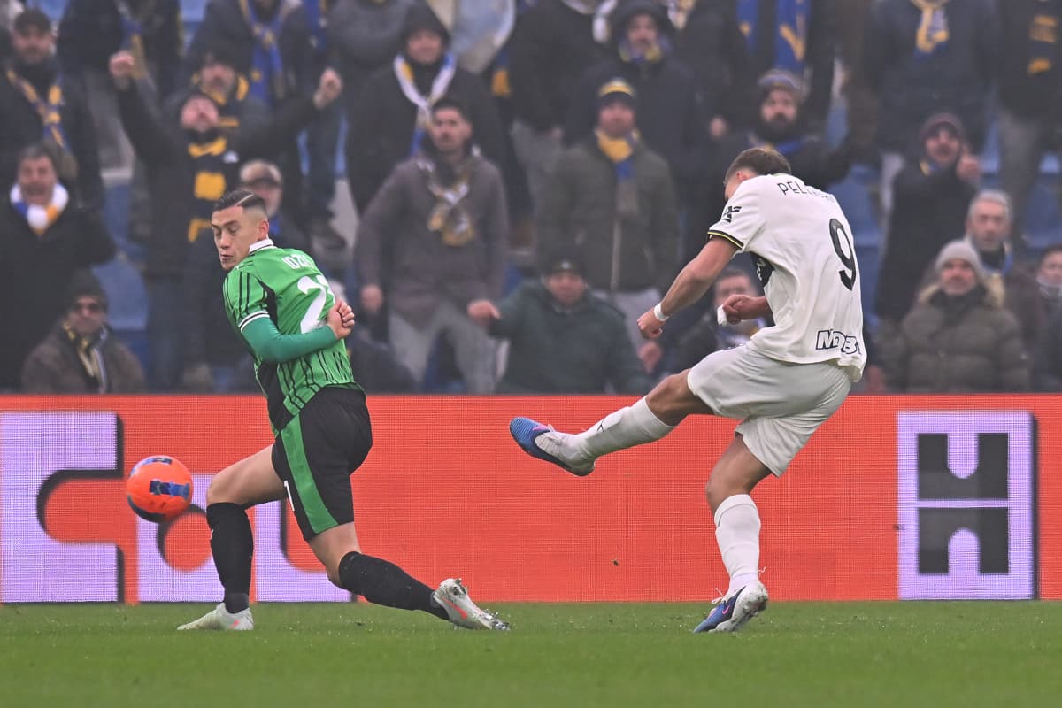 Player striking the ball during Parma vs Sassuolo match