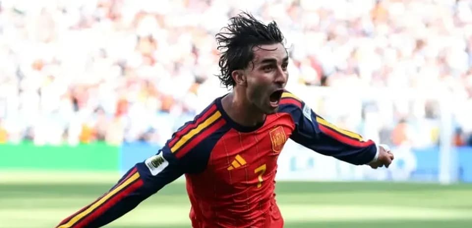 Player celebrating a goal for Spain during match