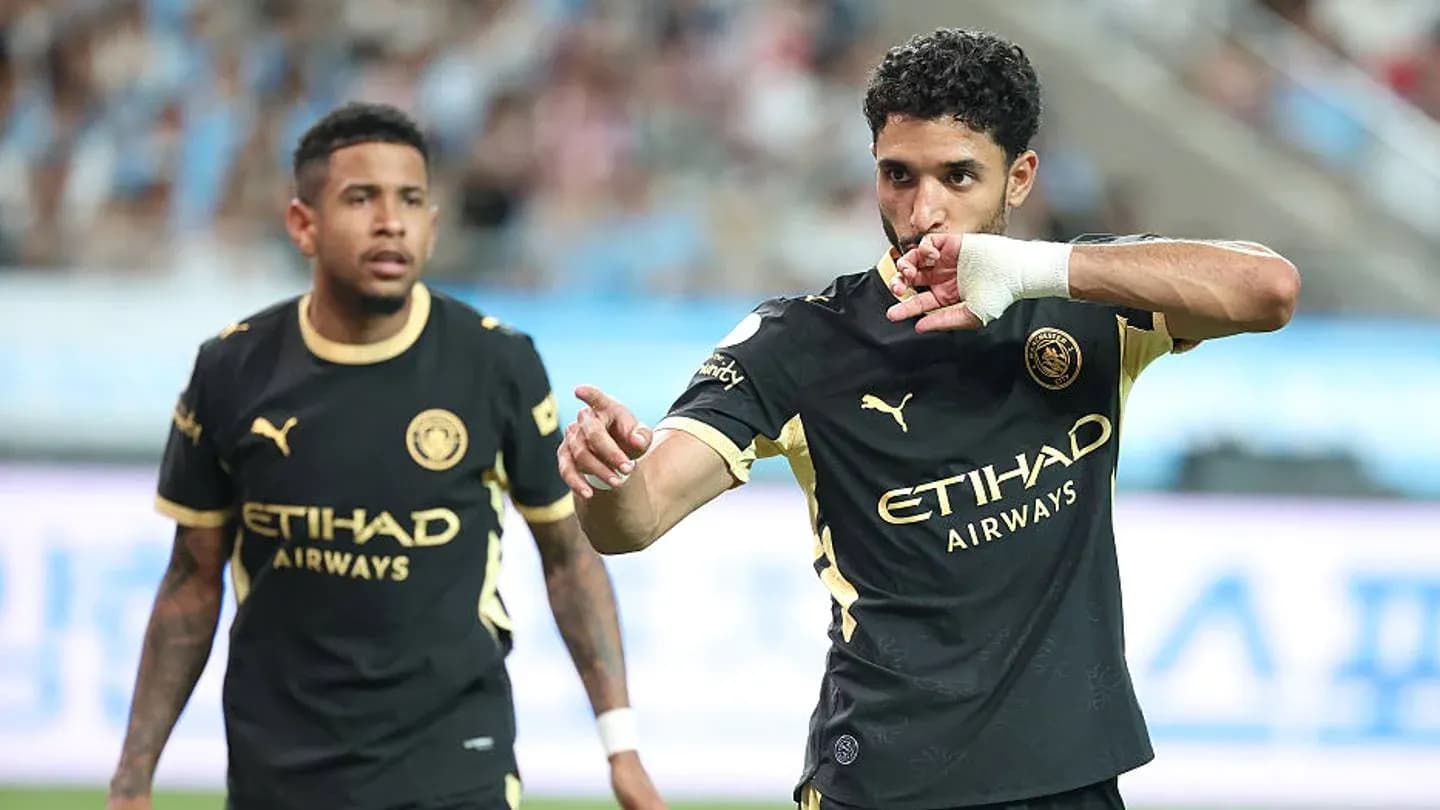 Player celebrating a goal with teammate nearby