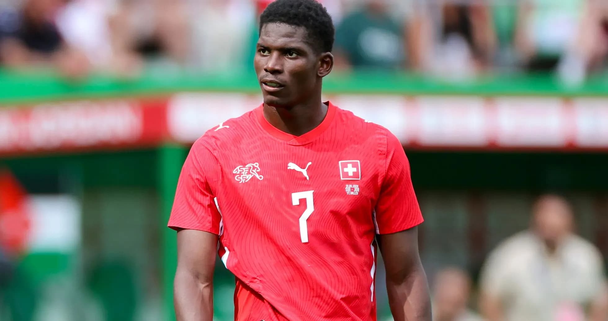 Player in red Swiss national team jersey on field