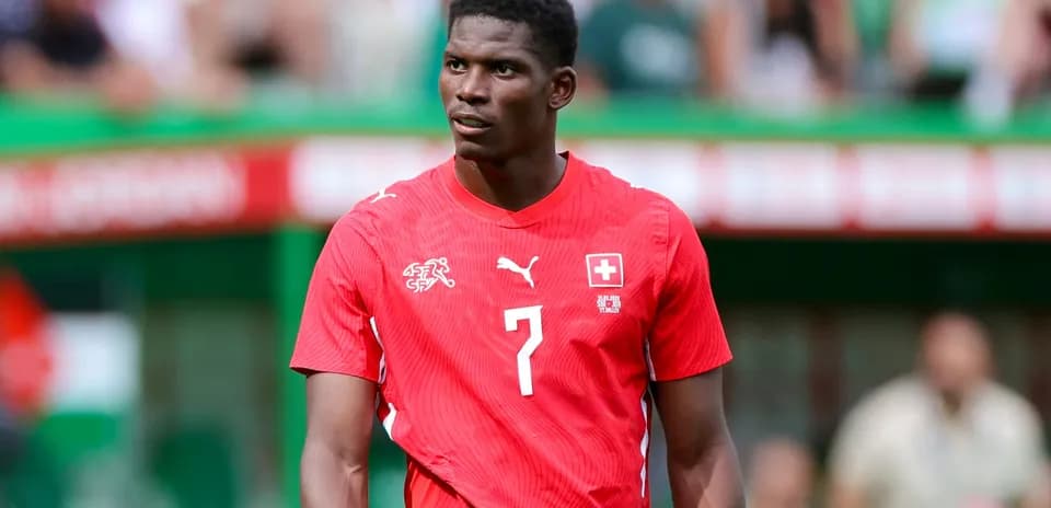 Player in red Swiss national team jersey on field