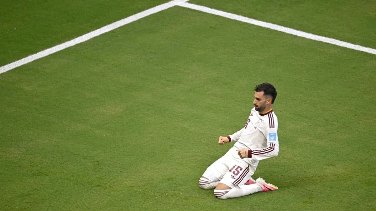 Player celebrating on the field after scoring
