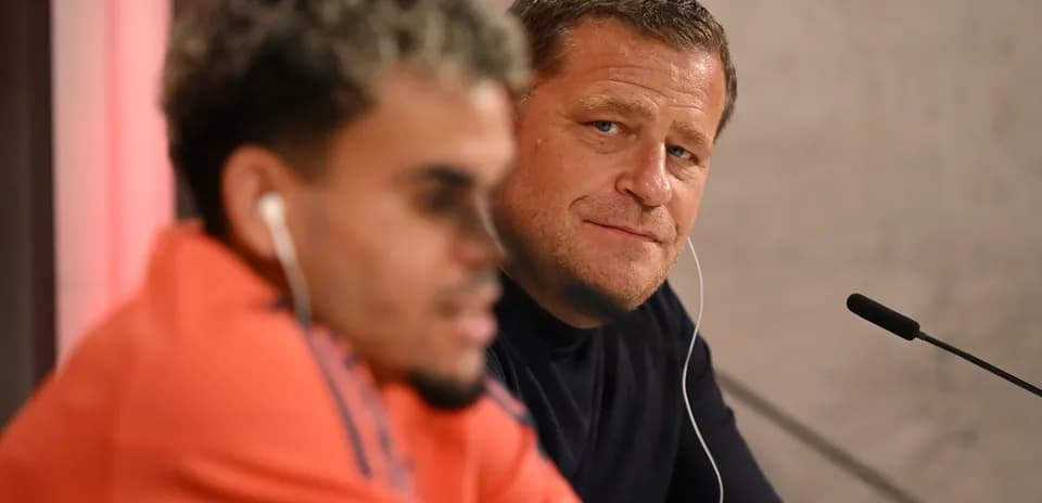 Two men at a press conference table