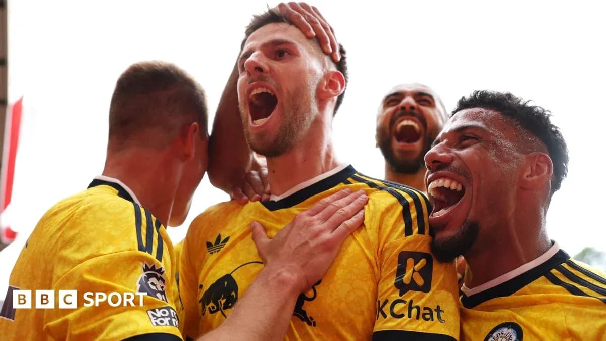Players celebrating a goal with joyful expressions