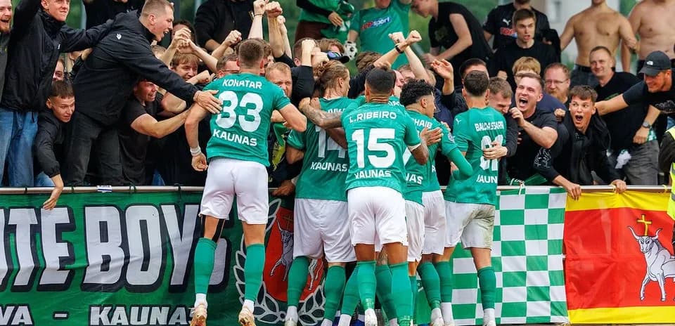 Žalgiris players celebrating with fans after goal