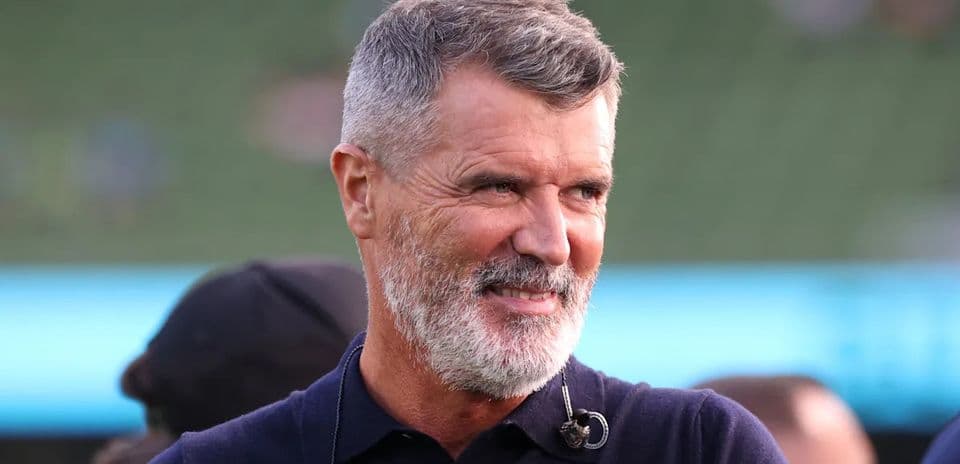 Man with a beard smiling at event