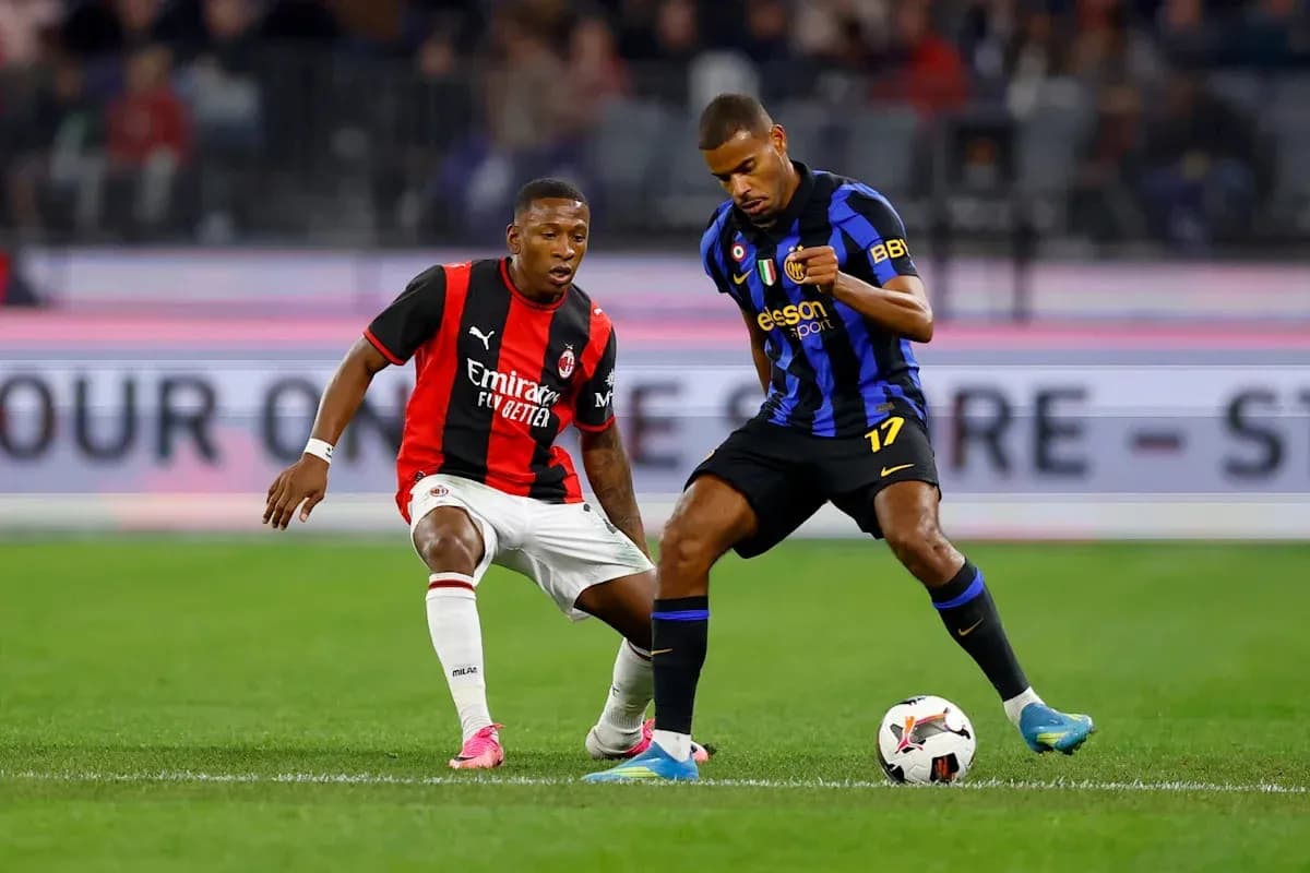 Two players contesting for the ball during match