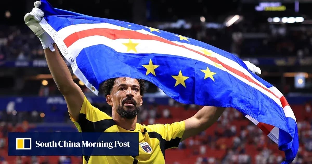 Player celebrating with Cape Verde flag after match