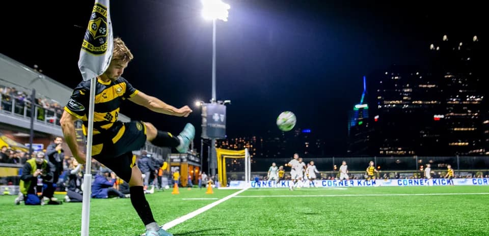 Player taking a corner kick during match