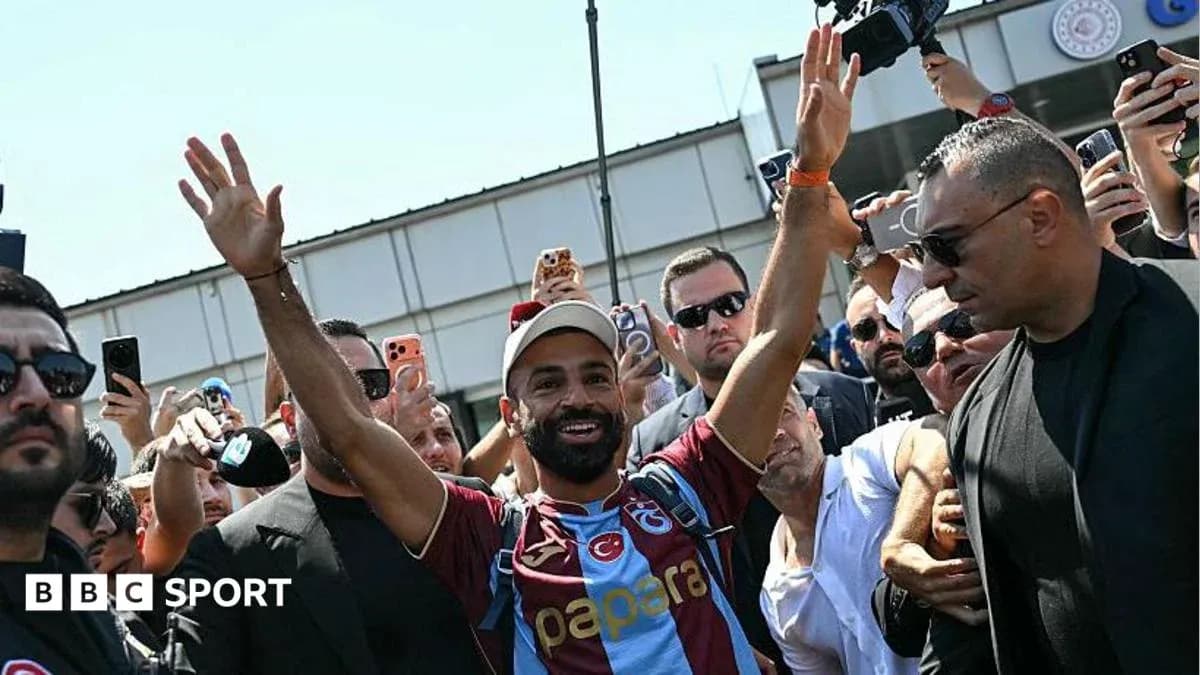 Player greeting fans upon arrival at airport