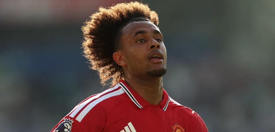 Player wearing Manchester United jersey on the field