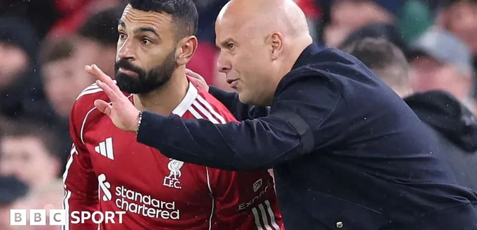 Player receiving instructions from coach on the sidelines