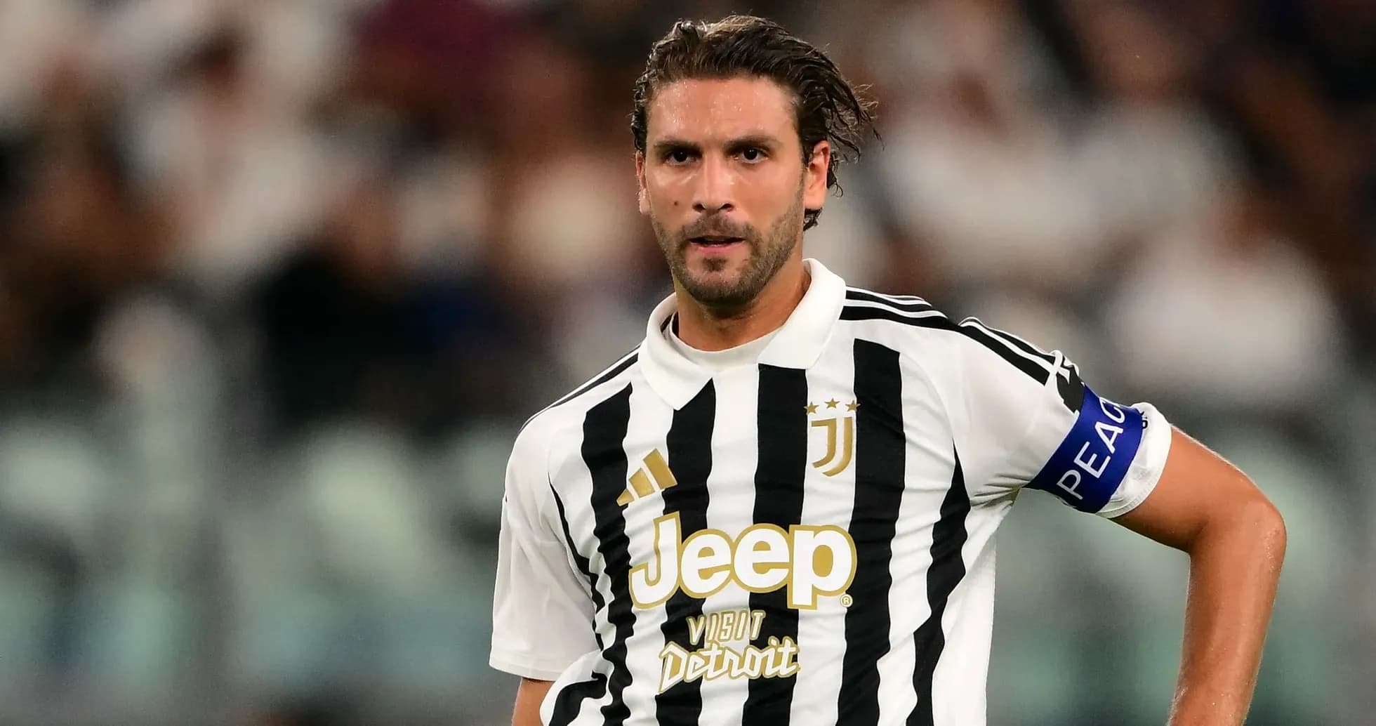 Juventus player in striped jersey on field