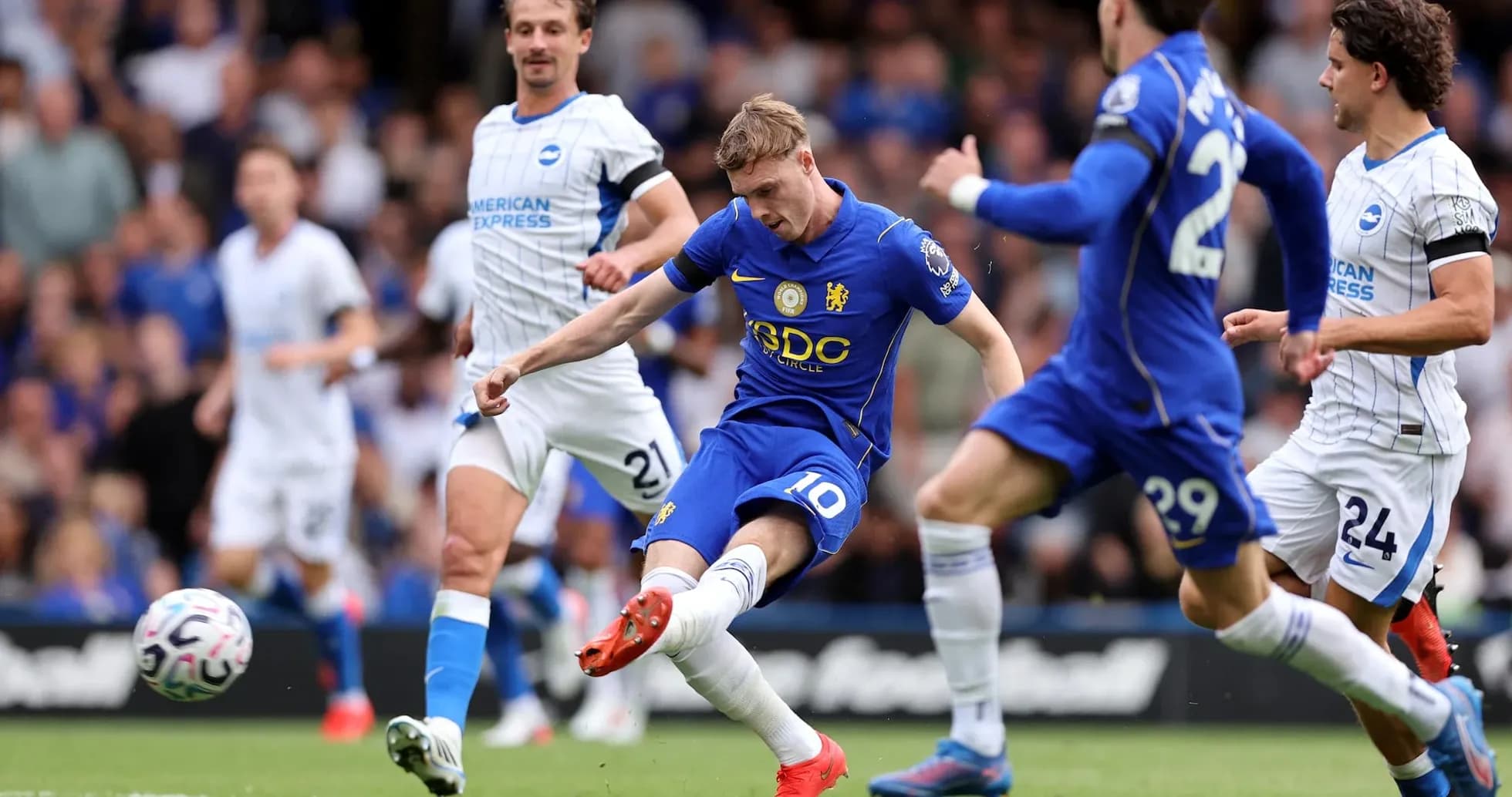 Chelsea player taking a shot on goal
