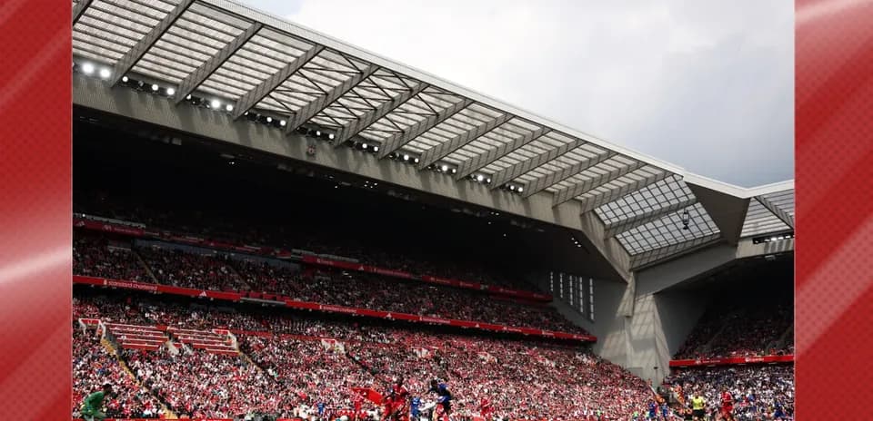 Crowd watching match at Anfield stadium
