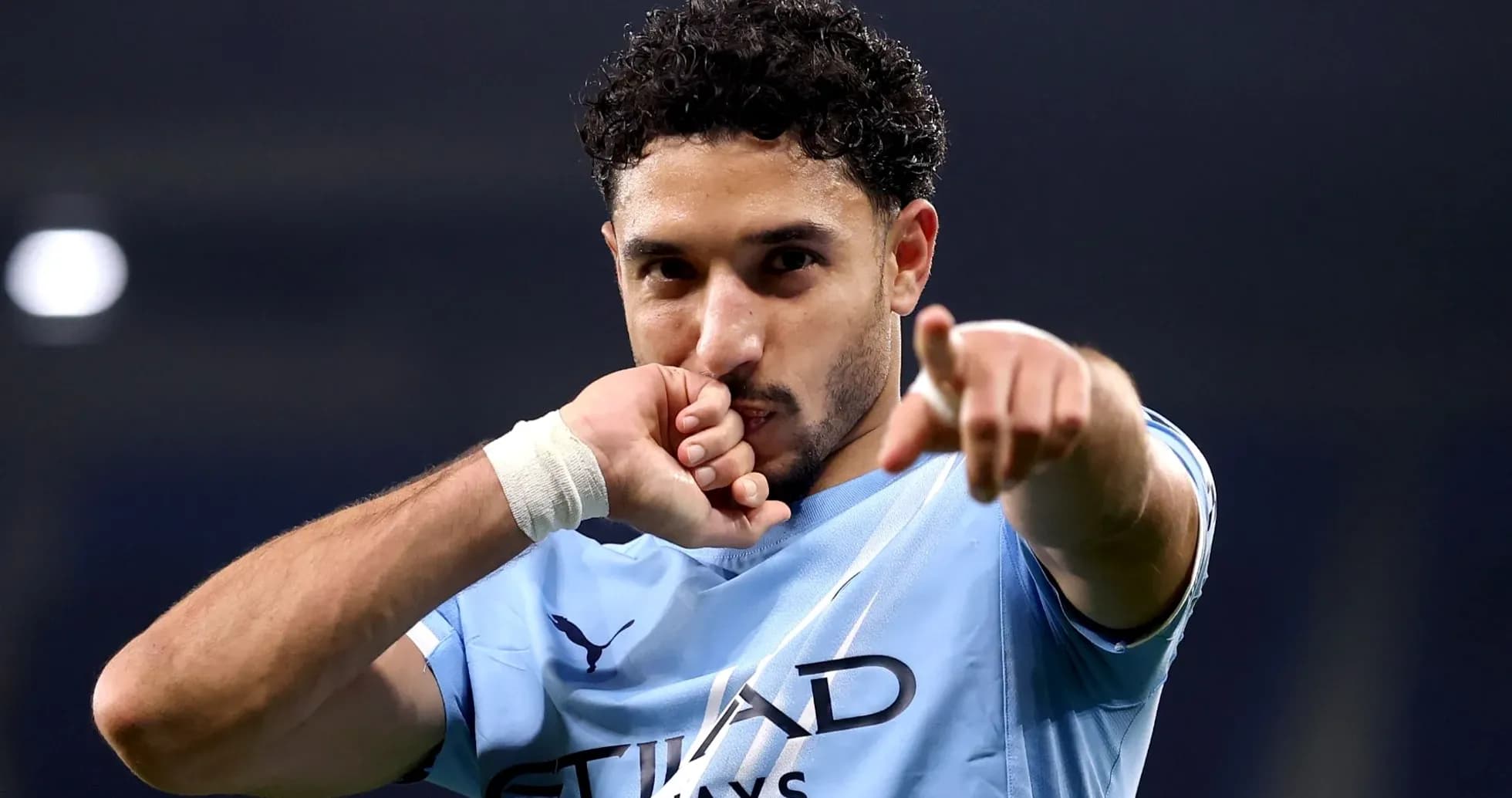 Player celebrating and pointing during a match