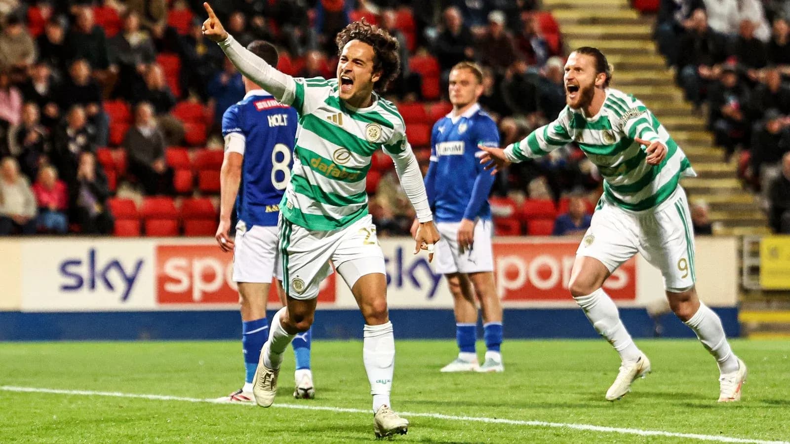 Celtic players celebrating a goal during match