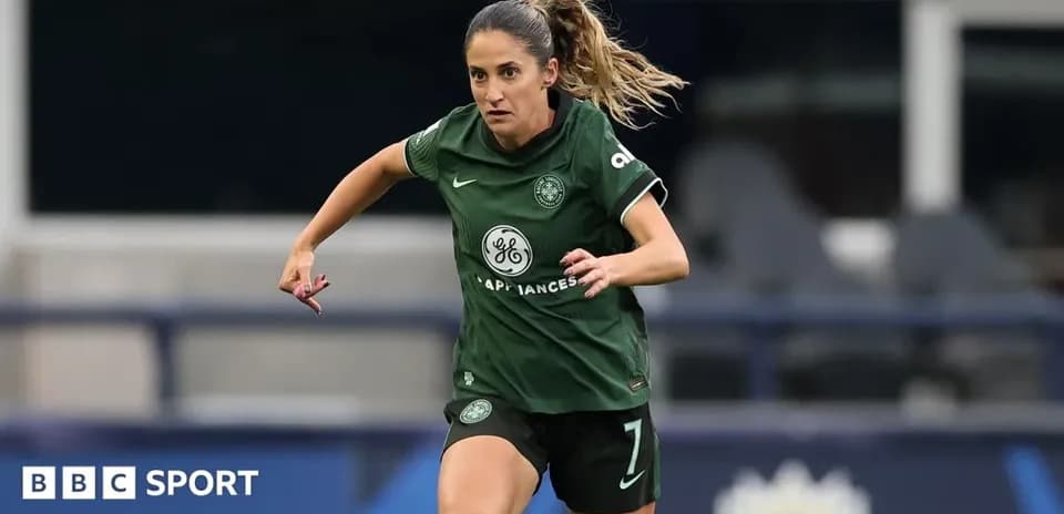 Player in green kit running on the pitch