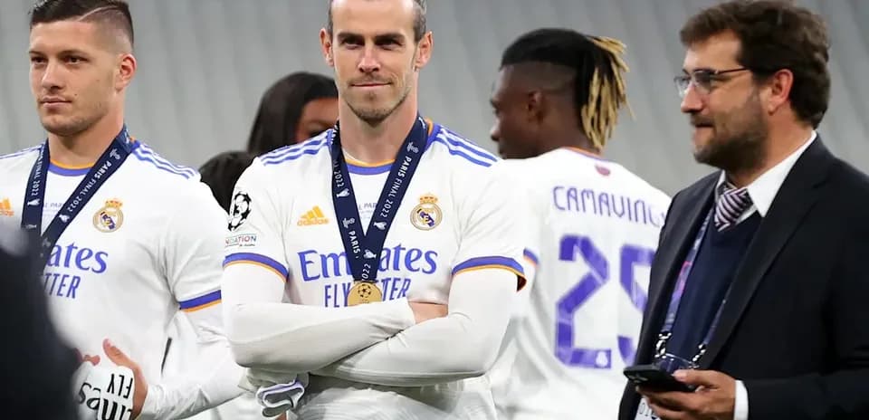 Real Madrid players celebrating with medals after match