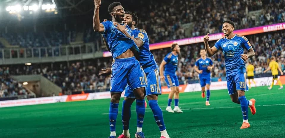 Players celebrating a goal during UEFA match