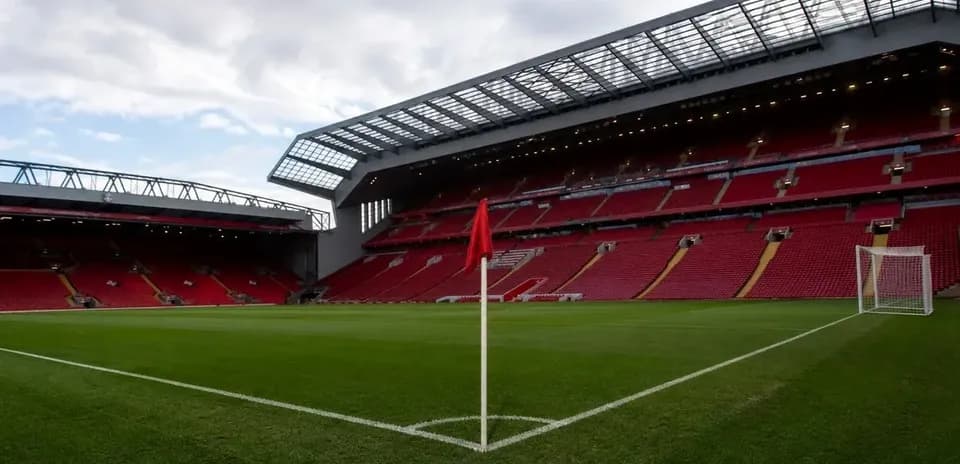 Corner flag in empty football stadium with seating