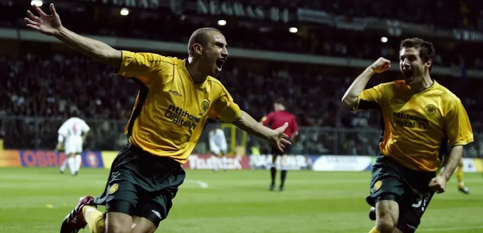 Players celebrating a goal on the pitch