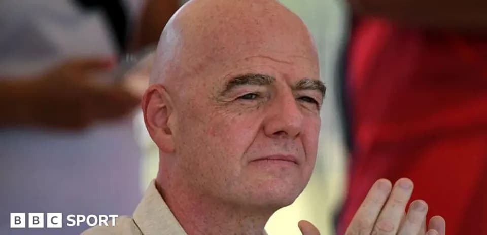 Man with bald head sitting and listening attentively