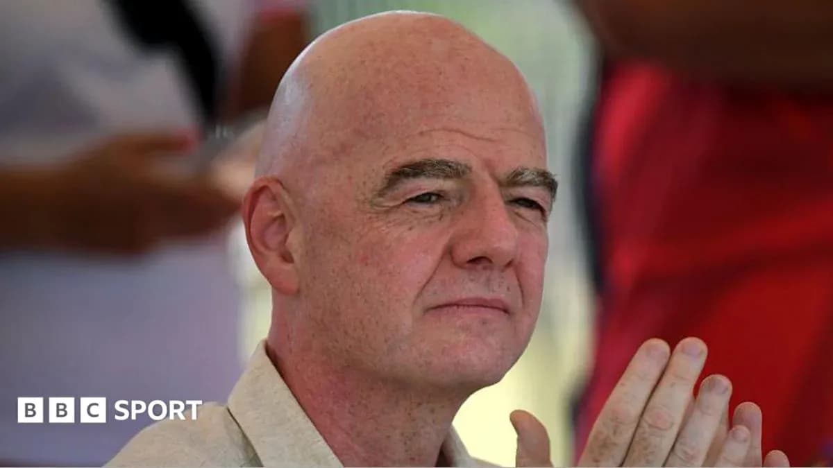 Man with bald head sitting and listening attentively