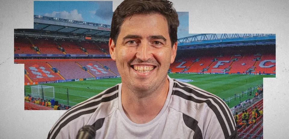 Smiling coach in Liverpool stadium before match