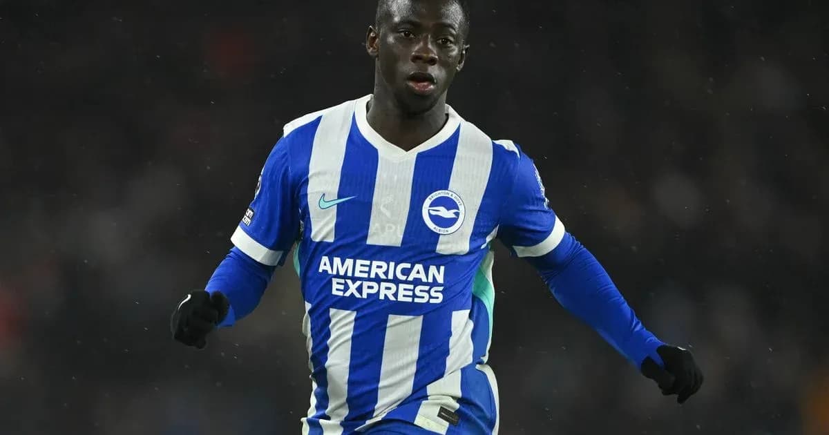 Player in blue and white kit celebrating on field