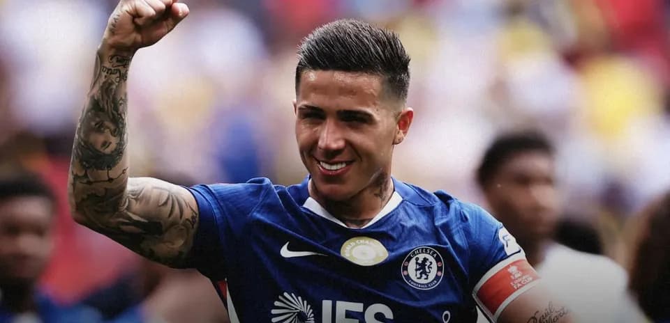 Player celebrating in Chelsea jersey with raised fist