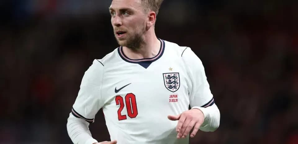 Player wearing England kit during match action