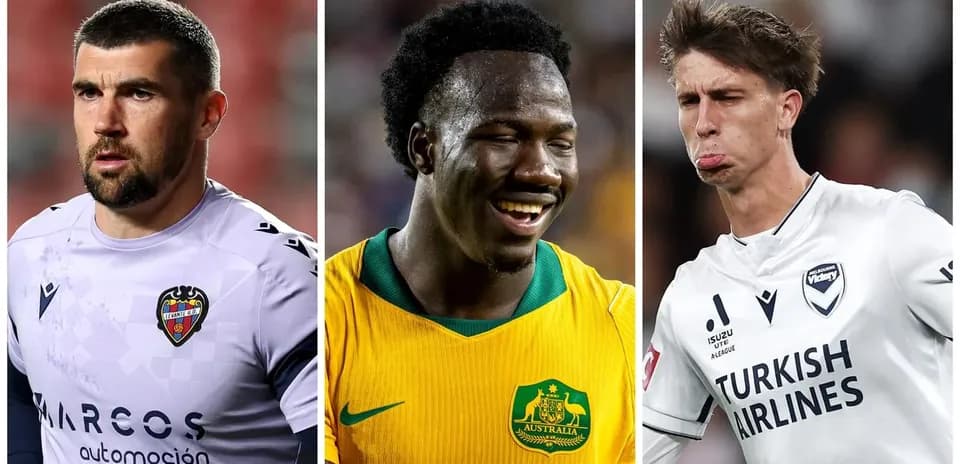Three soccer players in different kits on field
