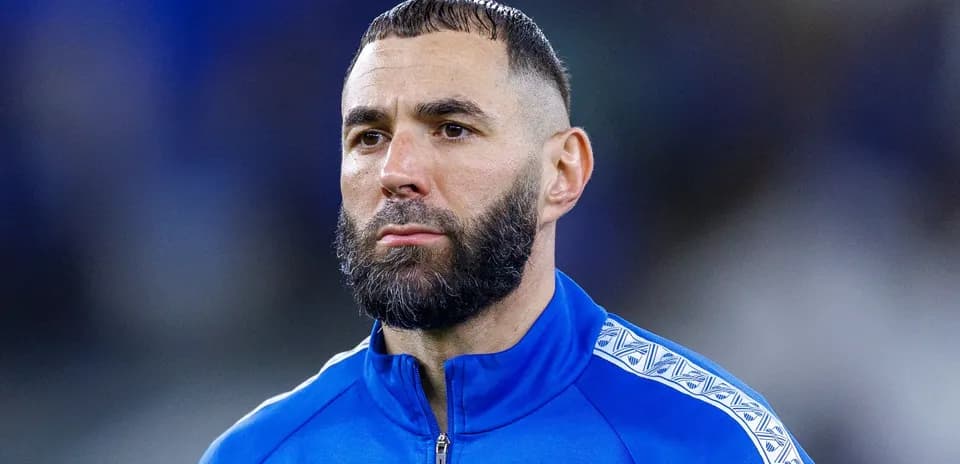 Player in blue training jacket during match preparation
