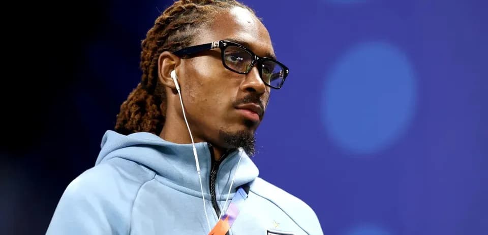 Player wearing glasses and headphones during event