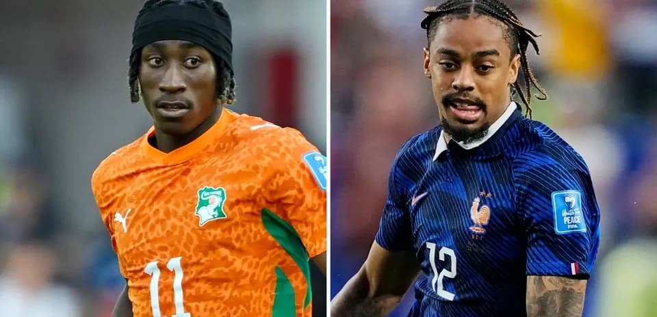 Two football players in their national team kits