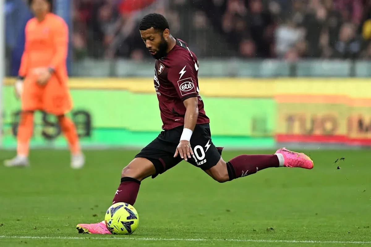 Player kicking the ball during a football match