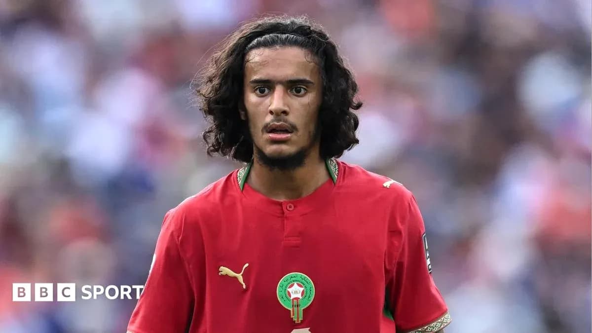 Player in red Morocco jersey during match