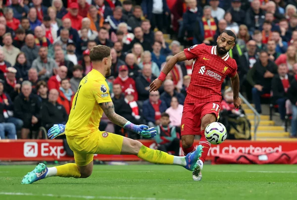 Liverpool player shooting on goal against Brentford