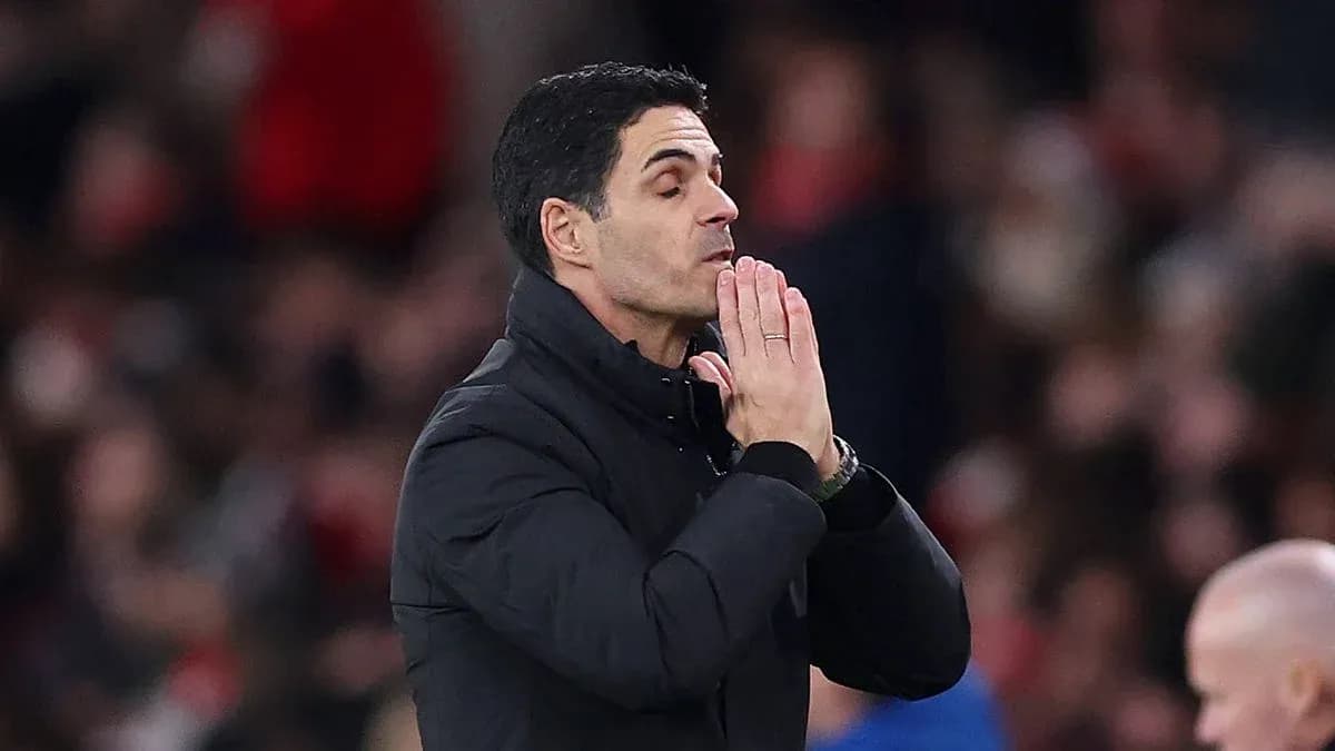 Manager gesturing during a match on the sidelines
