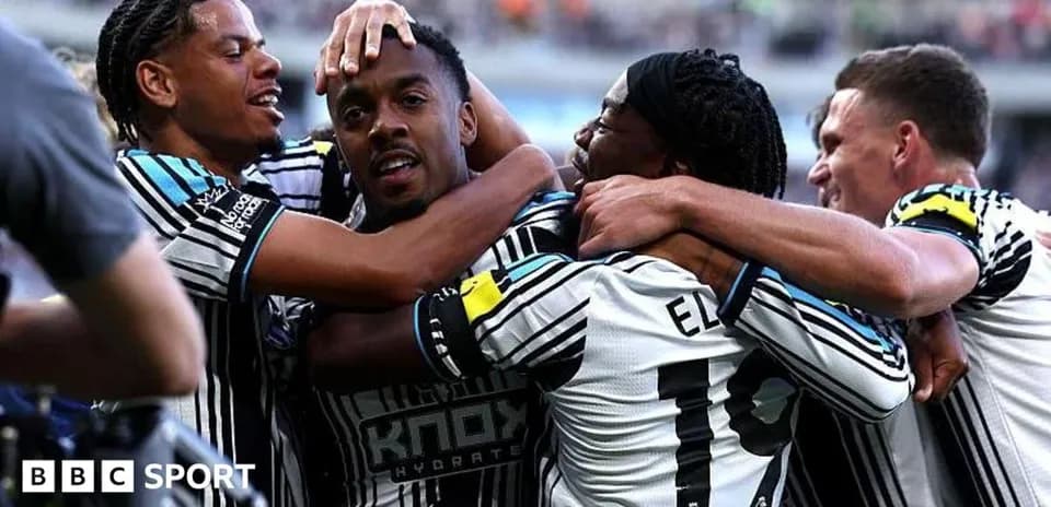 Players celebrating a goal on the field