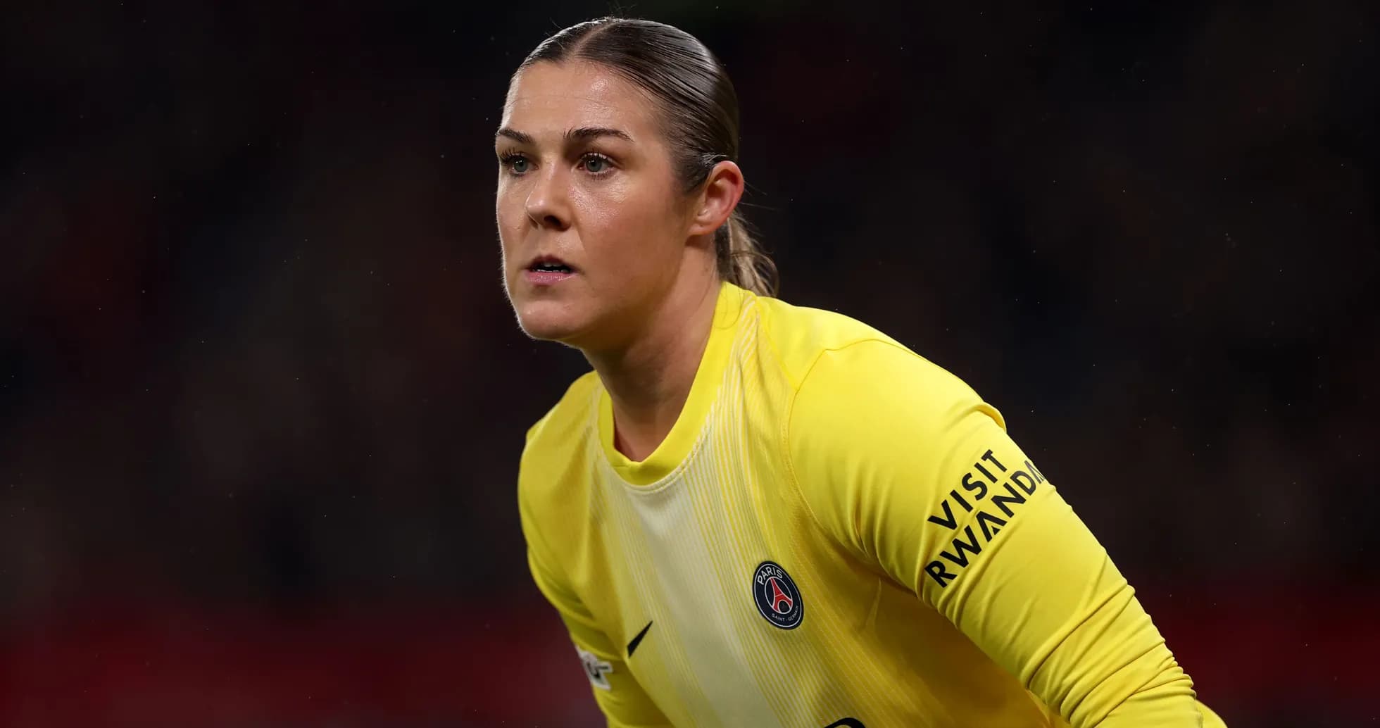 Goalkeeper in yellow jersey preparing for play